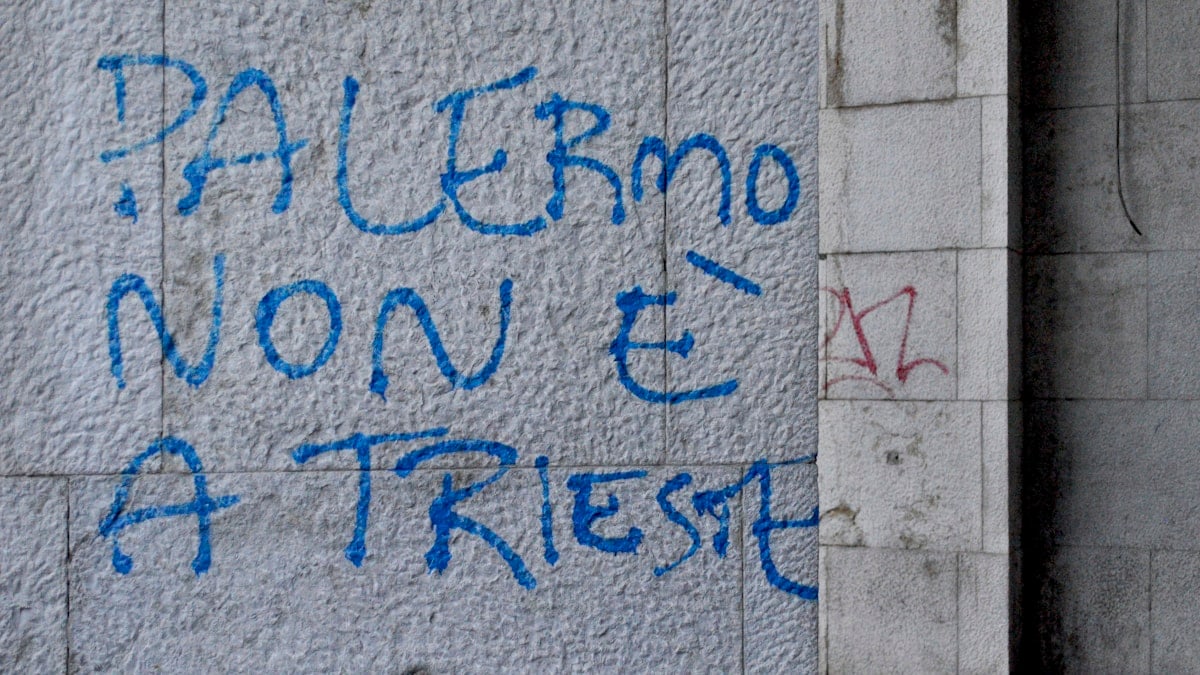 Graffiti in Trieste Italy Palermo non e Trieste on old wall